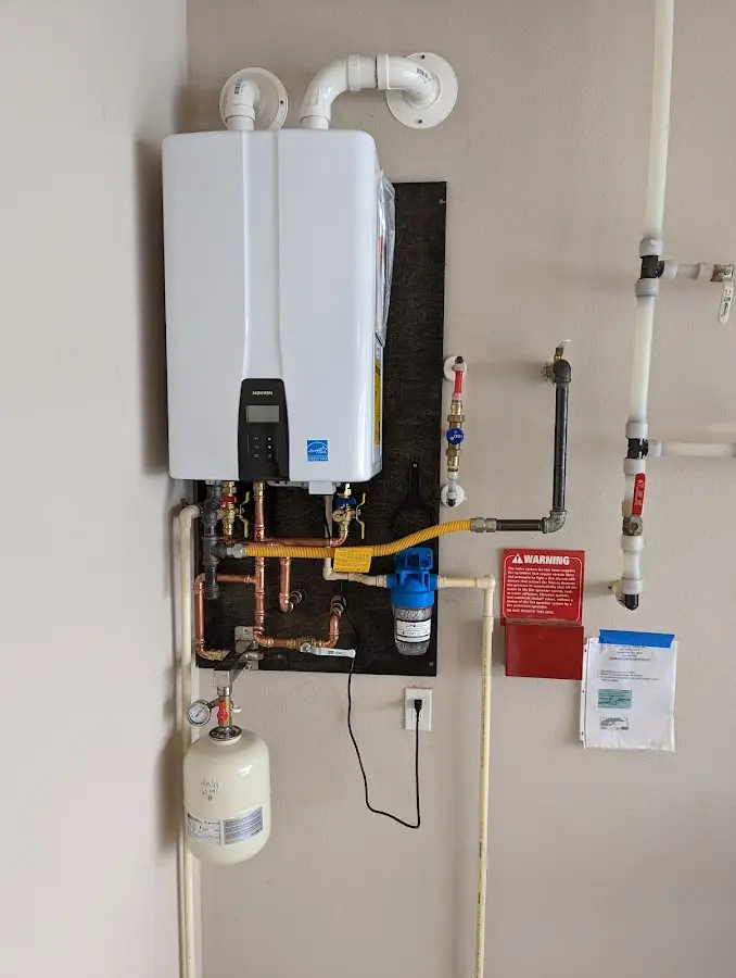 Professional plumber installing copper piping in a Kimberly home